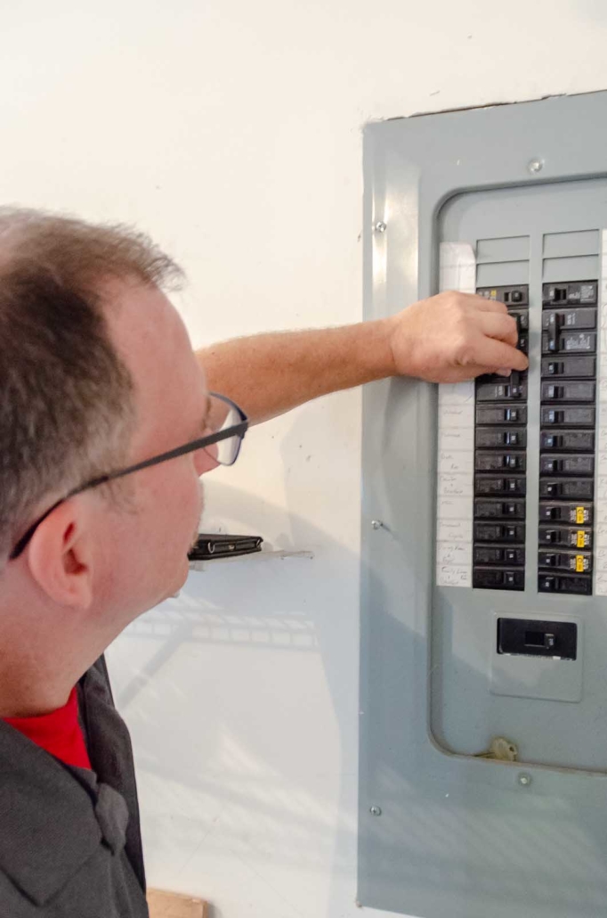 Home Inspector Looking at Electric Box